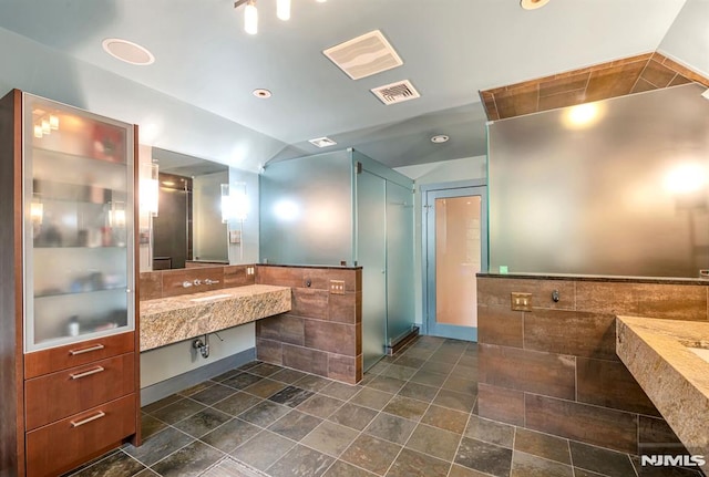 275 Gregory Rd, Franklin Lakes, NJ 07417 - bathroom with lofted ceiling, tile walls, and a shower with door