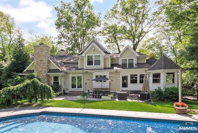 275 Gregory Rd, Franklin Lakes, NJ 07417 - back of house featuring entry steps, a lawn, a patio area, an outdoor pool, and a shingled roof