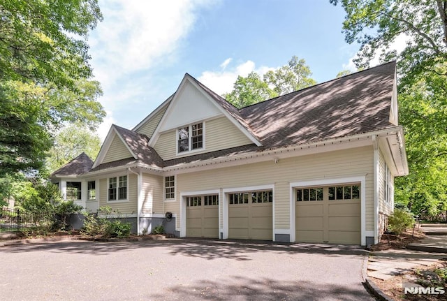 275 Gregory Rd, Franklin Lakes, NJ 07417 - view of front facade with driveway, a garage, and a shingled roof