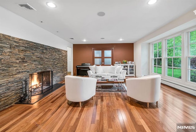 275 Gregory Rd, Franklin Lakes, NJ 07417 - living room with a fireplace, hardwood / wood-style flooring, recessed lighting, and a baseboard radiator
