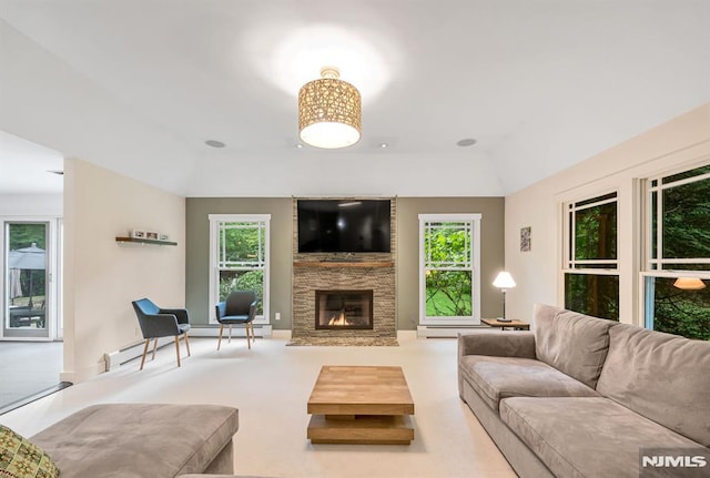 275 Gregory Rd, Franklin Lakes, NJ 07417 - living room featuring a large fireplace, vaulted ceiling, and a baseboard heating unit