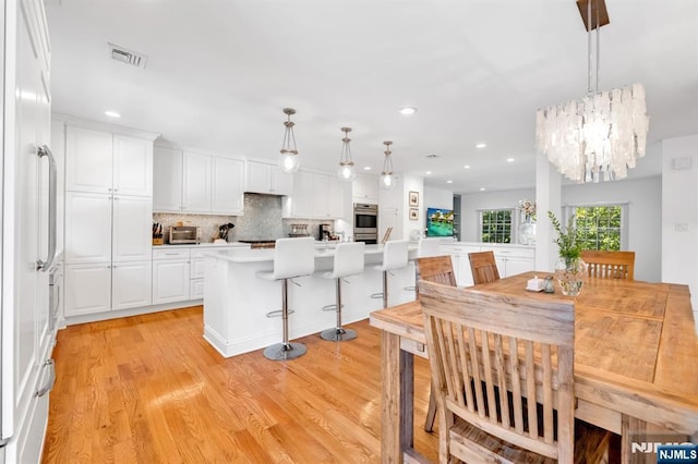 337 Vreeland Ave, Leonia, NJ 07605 - dining space with light wood-type flooring, a chandelier, and recessed lighting