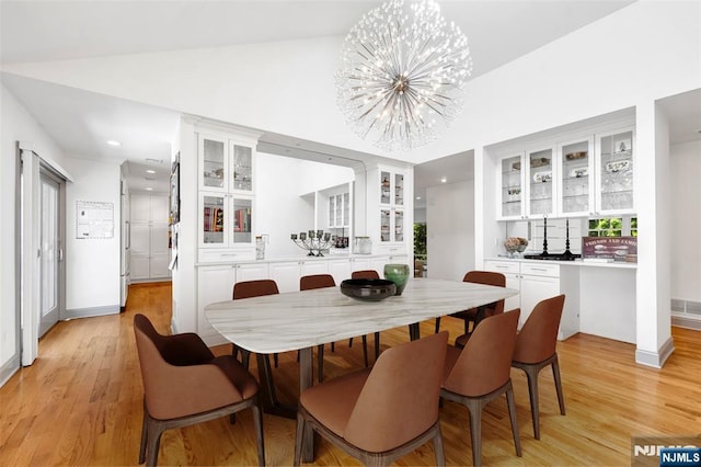 337 Vreeland Ave, Leonia, NJ 07605 - dining area with a chandelier, light wood-type flooring, lofted ceiling, recessed lighting, and baseboards
