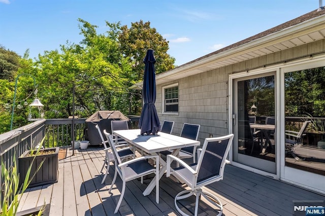 337 Vreeland Ave, Leonia, NJ 07605 - wooden deck with outdoor dining area and a grill