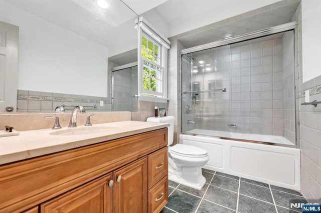 337 Vreeland Ave, Leonia, NJ 07605 - bathroom with vanity, toilet, enclosed tub / shower combo, tile patterned flooring, and recessed lighting