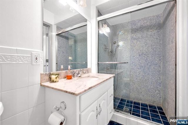 337 Vreeland Ave, Leonia, NJ 07605 - bathroom with vanity, a shower stall, tile walls, and toilet