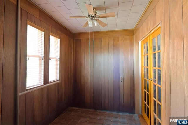 50 Richards Ave, Dover Town, NJ 07801 - empty room with wooden walls, ceiling fan, and french doors