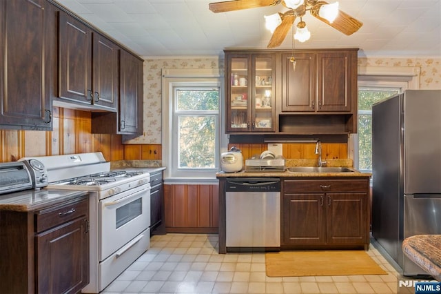 50 Richards Ave, Dover Town, NJ 07801 - kitchen featuring appliances with stainless steel finishes, wallpapered walls, a sink, healthy amount of natural light, and ceiling fan