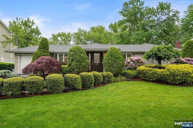 252 Oak Ave, River Edge, NJ 07661 - view of front facade with a front lawn, an attached garage, and a chimney