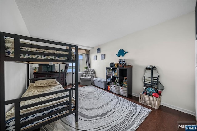 3 Horizon Unit 801, Fort Lee, NJ 07024 - bedroom featuring wood finished floors, baseboards, and a textured ceiling