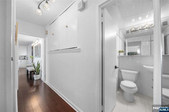 3 Horizon Unit 801, Fort Lee, NJ 07024 - bathroom featuring toilet and wood finished floors
