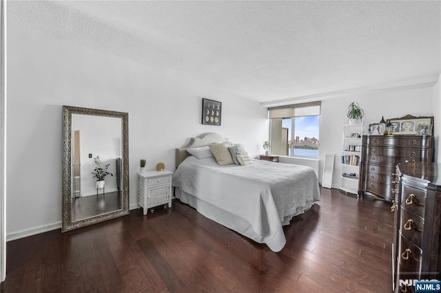 3 Horizon Unit 801, Fort Lee, NJ 07024 - bedroom with a textured ceiling and dark wood-type flooring