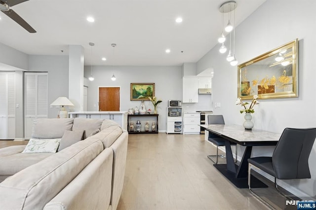 240 Main St Unit 211, Little Falls, NJ 07424 - living room featuring light wood finished floors, ceiling fan, and recessed lighting