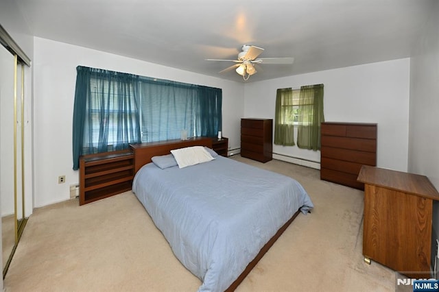 64 Rivervale Rd, Park Ridge, NJ 07656 - bedroom featuring a baseboard radiator, carpet floors, a ceiling fan, and a closet