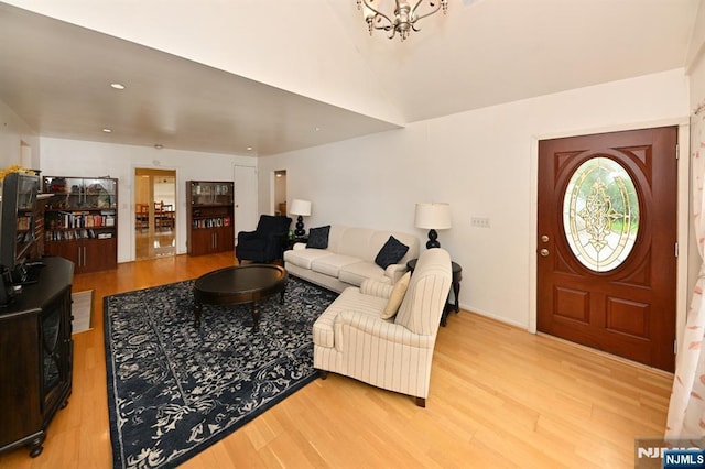 64 Rivervale Rd, Park Ridge, NJ 07656 - living area featuring light wood finished floors, vaulted ceiling, and a chandelier