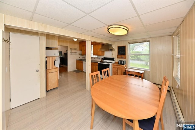 64 Rivervale Rd, Park Ridge, NJ 07656 - dining room featuring a paneled ceiling, a baseboard radiator, and light floors