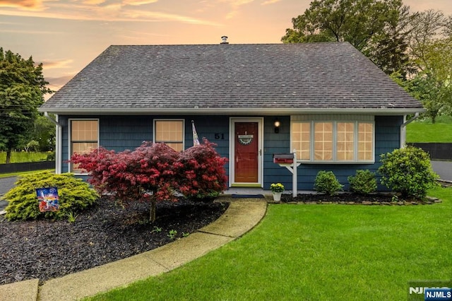 51 Sunrise Ter, Cedar Grove, NJ 07009 - view of front of house featuring a shingled roof and a front lawn