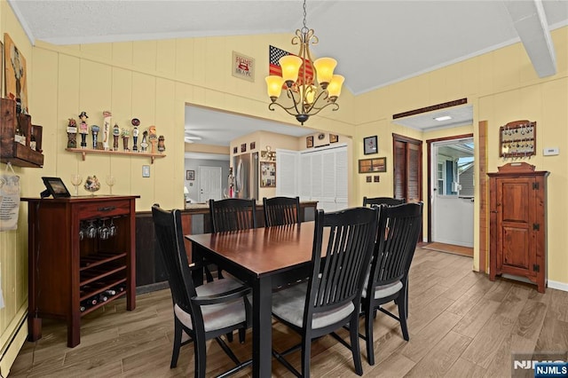 51 Sunrise Ter, Cedar Grove, NJ 07009 - dining space featuring vaulted ceiling, wood finished floors, a baseboard radiator, and a chandelier