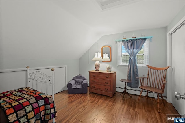 51 Sunrise Ter, Cedar Grove, NJ 07009 - bedroom with light wood-type flooring, baseboard heating, and lofted ceiling