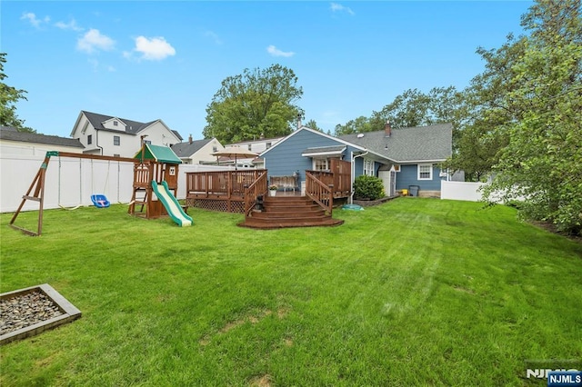 51 Sunrise Ter, Cedar Grove, NJ 07009 - view of yard with a playground and a wooden deck