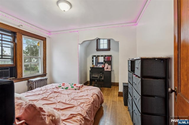 21 Berkeley Ave, Belleville, NJ 07109 - bedroom featuring radiator heating unit and light wood-style floors