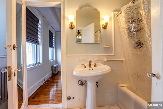 363-37 Mount Prospect Unit 2Aw, Newark, NJ 07104 - full bathroom with radiator, shower / bathtub combination with curtain, and wood finished floors