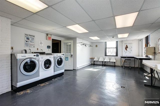 363-37 Mount Prospect Unit 2Aw, Newark, NJ 07104 - community laundry with a baseboard radiator, washer and dryer, and brick wall