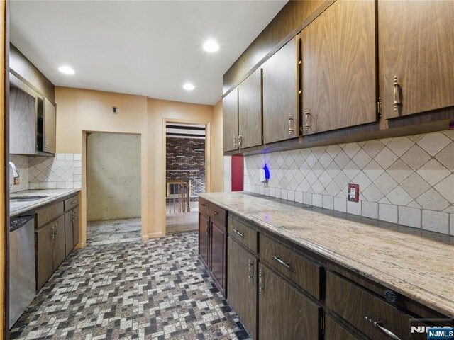 685 Maple Ave, Ridgefield, NJ 07657 - kitchen featuring a sink, stainless steel dishwasher, light countertops, tasteful backsplash, and recessed lighting