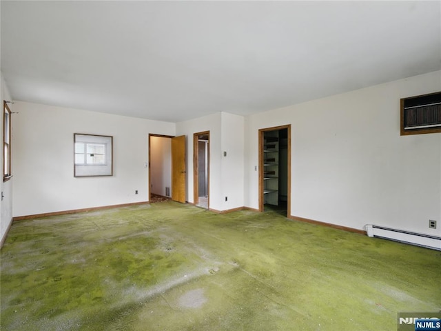 685 Maple Ave, Ridgefield, NJ 07657 - unfurnished room with baseboards, baseboard heating, and a wall mounted air conditioner