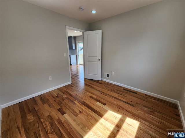 510 Anthony Ct, Lyndhurst, NJ 07071 - unfurnished room featuring baseboards, wood finished floors, a smoke detector, and recessed lighting