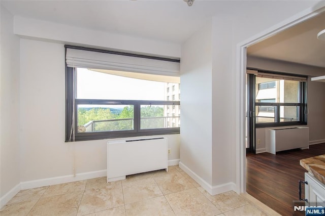 2 Clairidge Unit 3Nw, Verona, NJ 07044 - unfurnished room featuring radiator heating unit and baseboards