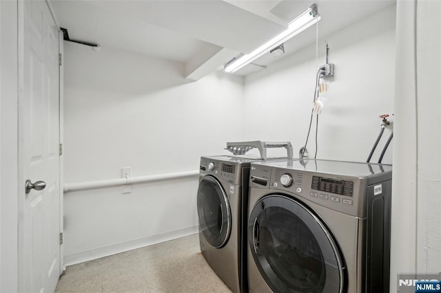 43 Lawrence Pkwy, Tenafly, NJ 07670 - laundry room with washer and clothes dryer and baseboards