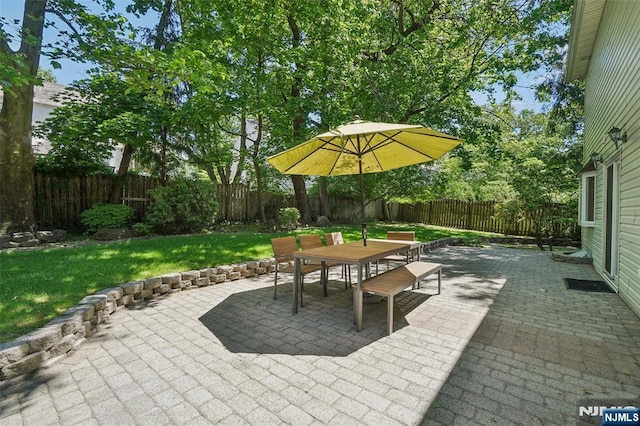 43 Lawrence Pkwy, Tenafly, NJ 07670 - fenced backyard with outdoor dining area and a patio area