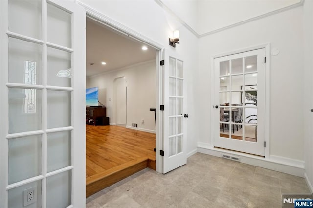 43 Lawrence Pkwy, Tenafly, NJ 07670 - entryway featuring french doors, arched walkways, recessed lighting, and tile patterned floors