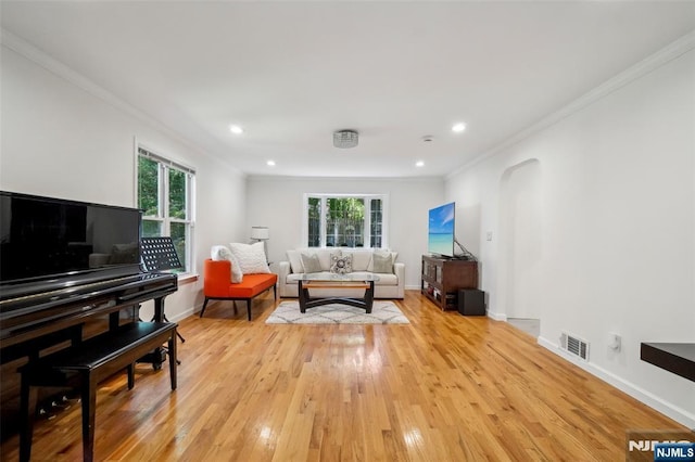 43 Lawrence Pkwy, Tenafly, NJ 07670 - living area featuring healthy amount of natural light, ornamental molding, light wood-style flooring, arched walkways, and recessed lighting