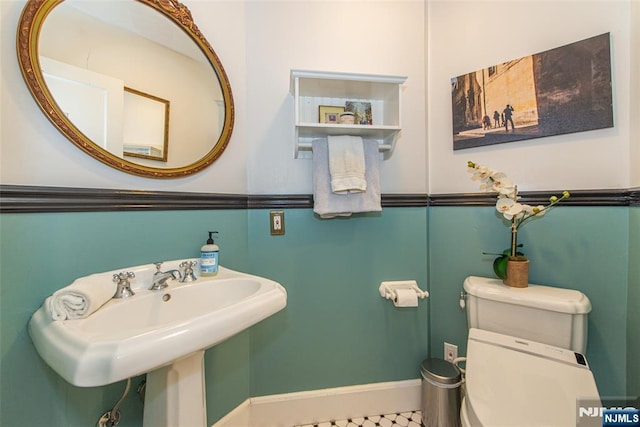 449 E Valley Rd, Montclair, NJ 07043 - bathroom with toilet, baseboards, and a sink