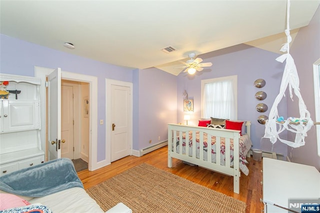 449 E Valley Rd, Montclair, NJ 07043 - bedroom with baseboard heating, light wood-style flooring, baseboards, and a ceiling fan
