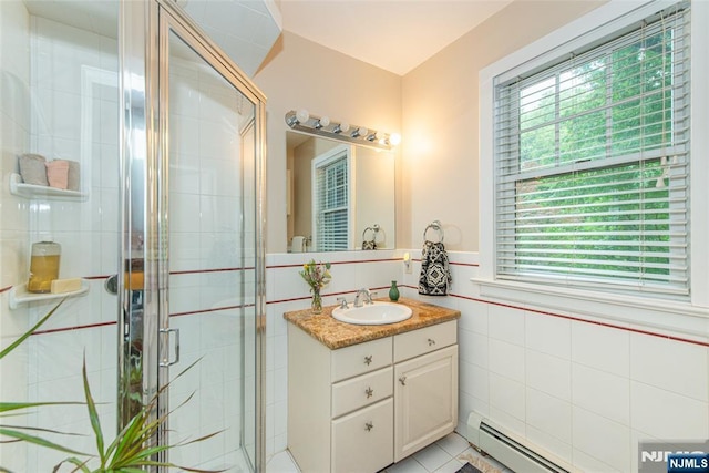 449 E Valley Rd, Montclair, NJ 07043 - full bath featuring tile walls, vanity, a shower stall, and a baseboard radiator