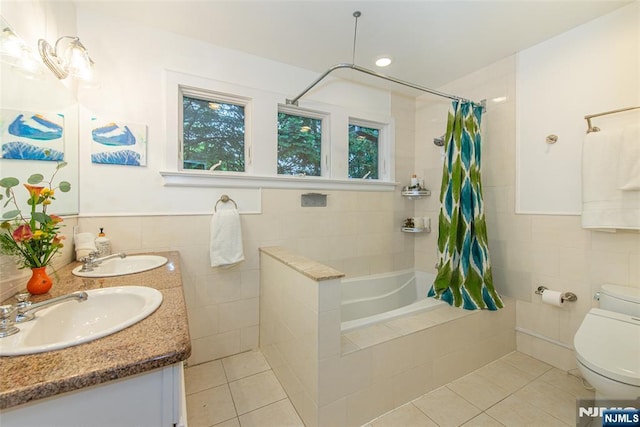 449 E Valley Rd, Montclair, NJ 07043 - bathroom featuring tile walls, tile patterned flooring, toilet, double vanity, and tiled shower / bath