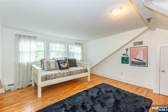 449 E Valley Rd, Montclair, NJ 07043 - living room featuring wood finished floors, baseboard heating, and baseboards