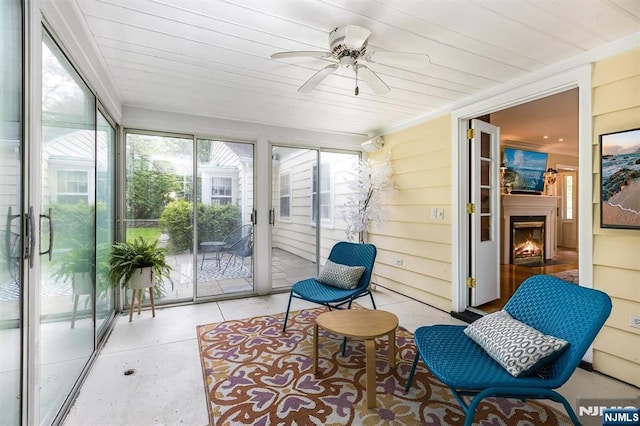 9 Stonewood Pkwy, Verona, NJ 07044 - sunroom with ceiling fan and a warm lit fireplace