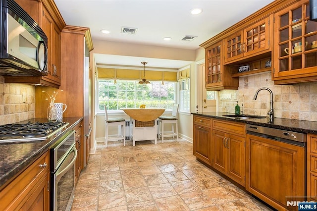 9 Stonewood Pkwy, Verona, NJ 07044 - kitchen with appliances with stainless steel finishes, a sink, brown cabinets, baseboards, and recessed lighting