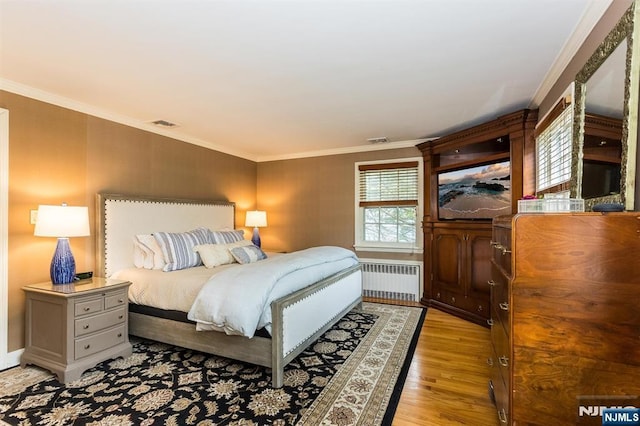 9 Stonewood Pkwy, Verona, NJ 07044 - bedroom featuring radiator heating unit, light wood-style flooring, crown molding, and baseboards