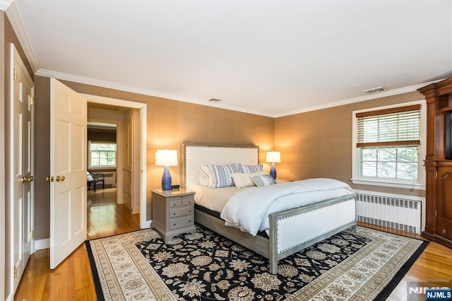 9 Stonewood Pkwy, Verona, NJ 07044 - bedroom featuring radiator heating unit, light wood finished floors, crown molding, and baseboards
