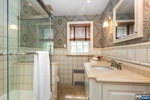 9 Stonewood Pkwy, Verona, NJ 07044 - full bathroom with radiator heating unit, wallpapered walls, vanity, toilet, and wainscoting