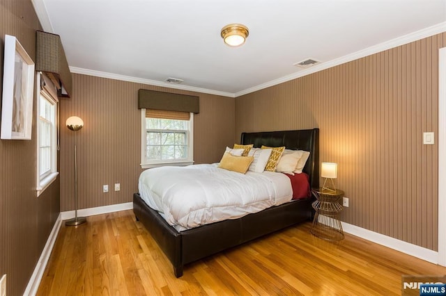 9 Stonewood Pkwy, Verona, NJ 07044 - bedroom with light wood-style flooring, baseboards, and ornamental molding