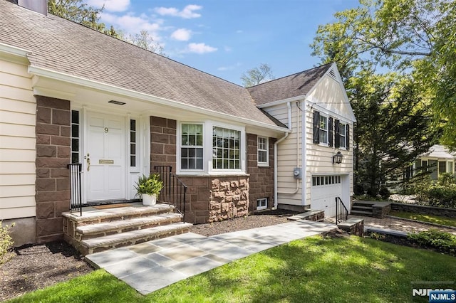 9 Stonewood Pkwy, Verona, NJ 07044 - doorway to property with stone siding, roof with shingles, and a garage
