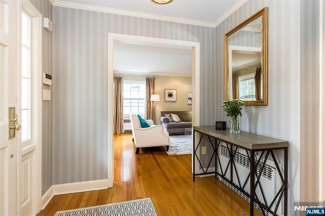 9 Stonewood Pkwy, Verona, NJ 07044 - entrance foyer featuring wallpapered walls, wood finished floors, healthy amount of natural light, crown molding, and radiator heating unit