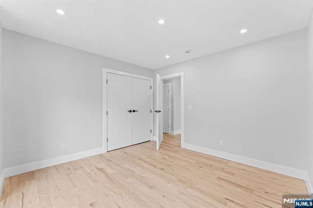 71 Watson Ave, East Orange, NJ 07018 - unfurnished bedroom featuring baseboards, wood finished floors, recessed lighting, and a closet