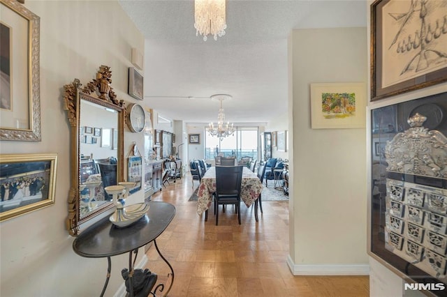 1530 Palisade Ave Unit 21M, Fort Lee, NJ 07024 - dining space featuring a chandelier and baseboards